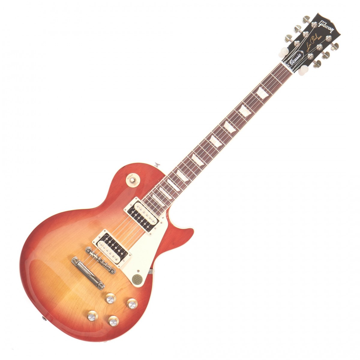 En bild på Gibson Les Paul Classic Heritage Cherry Sunburst | Du vet redan. Les Paul är en legend. Denna Gibson Les Paul Classic är ännu en reason till att den legenden kommer att fortsätta leva under kommande generationer. Det är utformat med gitarrens heritage i åtanke och levererar den ikoniska Gibson-ton i en snygg modell som utseende som om den kommer direkt från 60-talet - och landade på 2000-talet redo att rocka n roll.  Det känns fantastiskt i dina händer. Eftersom det inte finns något som liknar dess äkta palissander-keyboard som ger smidig spelbarhet. Dessutom har du all den kraft och mångsidighet du kan förvänta dig av en Les Paul. Och mer. Burstbucker-pickupar låter dig spränga varje ton med hög volym - utan feedback. De ger dig en mängd tonalternativ också tack vare spolavtappning och fasomkoppling. Det finns inte mycket den här gitarren inte ger dig faktiskt. Upplev genialiteten hos den klassiska Les Paul.  Ex-Demo: Denna produkt kan vara ex-display ha mindre tecken på användning eller lätta ytliga skråmor och sakna icke-nödvändiga delar. Originallåda paketering eller manual kanske inte ingår. Varje föremål kontrolleras av vårt team av reparationstekniker för att försäkra att det möter våra höga standarder. Detta är en fantastisk möjlighet att köpa en fullt fungerande produkt till ett nedsatt pris.