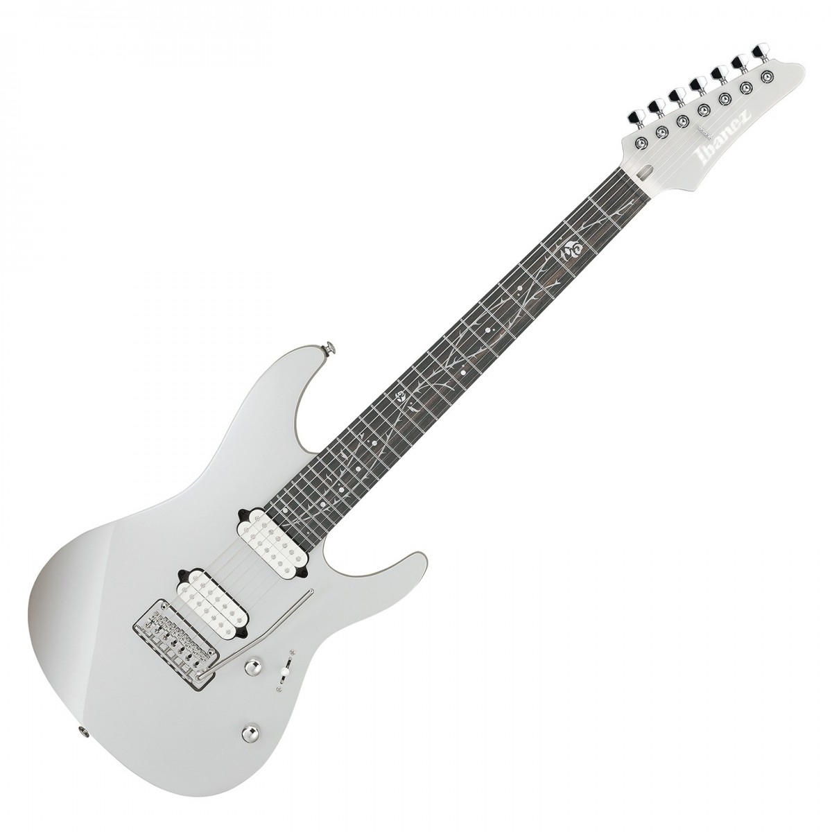 En bild på Ibanez TOD70 Tim Henson Signature 7 String Tree Of Death | Ibanez TOD70 Tim Henson Signature 7-strängad är sinnebilden av precision och mångsidighet skräddarsydd för att möta den moderna gitarristens krav. Den här modellen bygger vidare på TOD10:s grund med en sjunde sträng vilket breddar tonregistret och möjliggör djupare och rikare ljudbilder. TOD70 har en hals i Oval C Roasted Maple och en greppbräda från Ebenholts och erbjuder exceptionell spelbarhet och respons. Dess slående estetik markerad av "Tree of Death"-inlägget är både en blinkning till traditionen och ett djärvt steg framåt. Utrustad med Fishman® Fluence™ Tim Henson Signature pickuper levererar denna gitarr ett spektrum av toner från aggressiva rytmer till de renaste enstaka-coil-ljuden. De Gotoh® MG-T låsbara maskhuvudena och Gotoh® T1572S tremolostalln förbättrar instrumentets stämningsstabilitet och artikulation vilket är viktigt för både studioinspelningar och live framträdanden. Med självlysande sidopunkter för synlighet på mörka scener och en skyddande väska ingår är TOD70 utformad för att inspirera och prestera på högsta nivå.