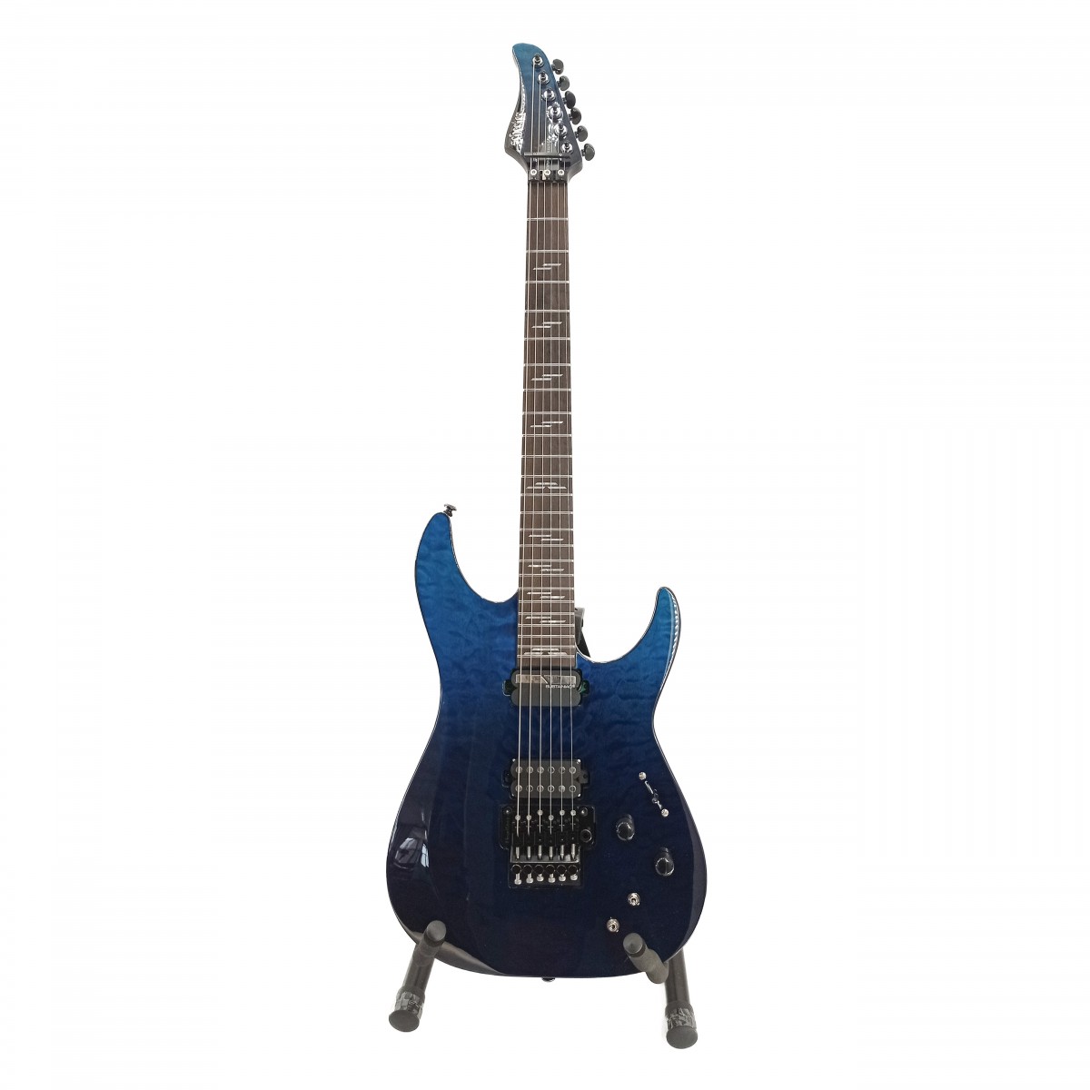 En bild på Schecter Reaper-6 Elite FR-S Deep Ocean Blue - Ex Demo | Schecter Reaper-6 Elite FR-S är en blixt av metallmagi. Den är snygg mörk och dödlig och kommer pumpa ut power-ackorden med explosiv styrka. Detta är på grund av den dödliga pickup-duon som FR-S stoltserar med. Den består av en grym Schecter USA San Andreas-pickup tillsammans med en Sustainiac-pickup. Genom att erbjuda dig ett brett spektrum av brinnande ljud kommer de att vråla ut tuggande basljud och tjuta genom solon för att förtrolla din publik. Scenen är din.    Denna gitarr har ljud som är värda Grim Reaper men hur spelar den? Svaret är: snabbt. Väldigt snabbt. Med en lyxig greppbräda i ebenholts av högsta kvalitet har du tillgång till alla slags galna riff. Den är både härligt smidig och enkel att navigera och den C-formade halsen är perfekt för att shredda. Den är även supersnygg och en dröm att hålla i och kommer få dig att skjuta upp och ner längs halsen i blixtsnabb takt. Och ett låsande Floyd Rose tremolo-stall låter dig divebomba och spela vibraton med obegränsad frihet. Ex-Demo: Denna produkt kan vara ex-display ha mindre tecken på användning eller lätta ytliga skråmor och sakna icke-nödvändiga delar. Originallåda paketering eller manual kanske inte ingår. Varje föremål kontrolleras av vårt team av reparationstekniker för att försäkra att det möter våra höga standarder. Detta är en fantastisk möjlighet att köpa en fullt fungerande produkt till ett nedsatt pris.
