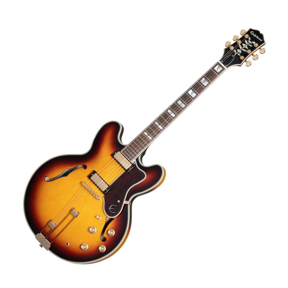 En bild på Epiphone Sheraton Frequensator Vintage Sunburst | Epiphone Sheraton Frequensator är en gitarr som kombinerar vintage med modern spelbarhet. Blueslegendaren John Lee Hookers utvalda Epiphone detta anrika instrument har en halv-ihålig kropp gjord av lagerlönn med ett mittblock i lönn för återkopplingsmotstånd. Den 22-bandade mahognyhalsen har en inbunden indisk lagerbräda med block av pearl med abalone triangle. En SlimTaper 60s C-profil på halsen gör det enkelt och bekvämt att spela under längre perioder medan gold inklusive en vintage-stil Frequensator Split Trapeze stränghållare lägger till den enkla och tidlösa estetiken hos denna Epiphone-legend.  Det är dags att leverera. Och Epiphone ProBucker mini humbuckers tar fram det bästa inom vilken musikgenre som helst. De har ett brett dynamiskt tonområde vilket gör den här gitarren till ett utmärkt val för alla musiker som söker mångsidighet. Med två volym- och två tonkontroller kan du hitta ett ljud som passar din stil oavsett om du spelar jazz rock eller blues. Denna gitarr kommer med en förstklassig väska som håller ditt instrument säkert under transport och förvaring. Väskan är designad för att passa gitarren tätt och ger maximalt skydd mot stötar och repor så att du kan ta med din Sheraton Frequenator vart du än går. Sammantaget är Epiphone Sheraton Frequenator ett utmärkt val för alla som letar efter ett klassiskt utseende och vintage i en modern gitarr.