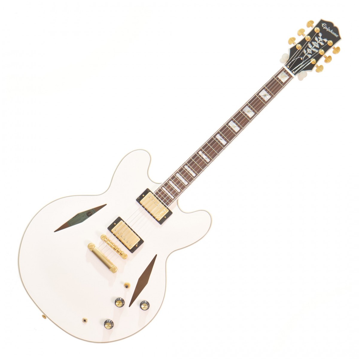 En bild på Epiphone Emily Wolfe “White Wolfe” Sheraton Aged Bone White - Ex Demo | Ex-Demo Detta instrument kan uppvisa lätta tecken på användning. Det har kvalitetskontrollerats av vårt team av reparationstekniker för att säkerställa att det uppfyller en hög spelstandard.  Eventuellt reklammaterial erbjudanden programvara eller prenumerationer som är tillgängliga när du köper den som ny kanske inte är tillgängliga med denna Ex-Demo produkt. Epiphone Emily Wolfe Vit Wolfe Sheraton är en extraordinär gitarr som representerar höjdpunkten av modern gitarrdesign och teknik. Varje detalj har noggrant utformats för att säkerställa att detta instrument ger en verkligt exceptionell spelupplevelse från greppbrädan i indisk laurel med blockinlägg av mother of pearl till Grover Rotomatic-stämskruvarna och GraphTech-Sadeln. Och med fullstora Epiphone Alnico ClassicPRO humbucker pickuper parade med CTS-potentiometrar kan du vara säker på att du får ett mjukt och kraftfullt ljud som passar alla stilar och genrer.  Men det som verkligen utmärker Emily Wolfe Vit Wolfe Sheraton apart är dess unika design. Abalone lightning bolt-inläggen på greppbrädan ger instrumentet en touch av personlighet och stil medan Aged Bone Vit-finishen och den åldrade gold -hårdvaran ger det ett tidlöst och klassiskt utseende. Och med ett EpiLite-fodral som ingår kan du vara säker på att din gitarr är skyddad och säker oavsett om du tar med den till spelningar eller förvarar den hemma. Oavsett om du är ett fan av Emily Wolfe eller bara letar efter en högkvalitativ och mångsidig gitarr som levererar imponerande ton och prestanda är Emily Wolfe Vit Wolfe Sheraton ett enastående val som inte kommer att göra dig besviken.